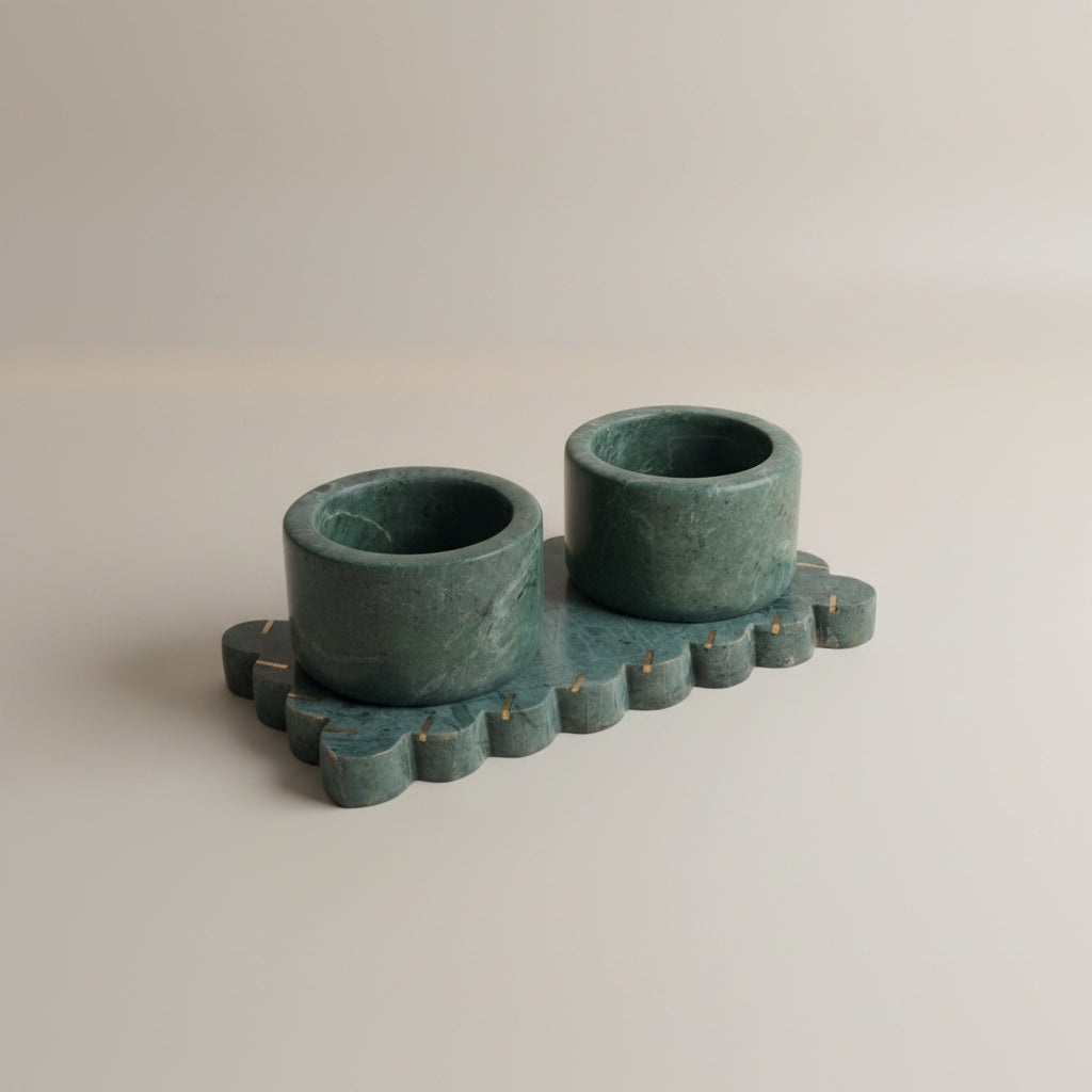 Baroda green marble dual pinch pot set — two cylindrical cups on scalloped marble tray with brass dot inlays, angled hero shot