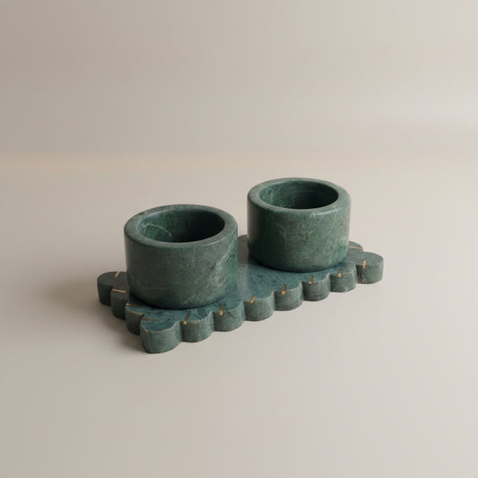 Baroda green marble dual pinch pot set — two cylindrical cups on scalloped marble tray with brass dot inlays, angled hero shot