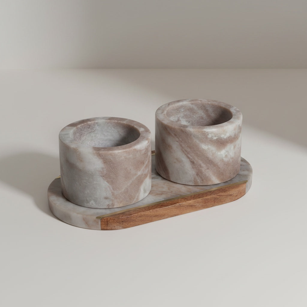 Toronto marble dual pinch pot set on half-marble half-acacia oval tray — angled hero shot showing warm grey stone and wood grain