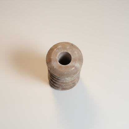 Morchana marble ribbed taper holder — side view showing horizontal ring texture and matte stone surface