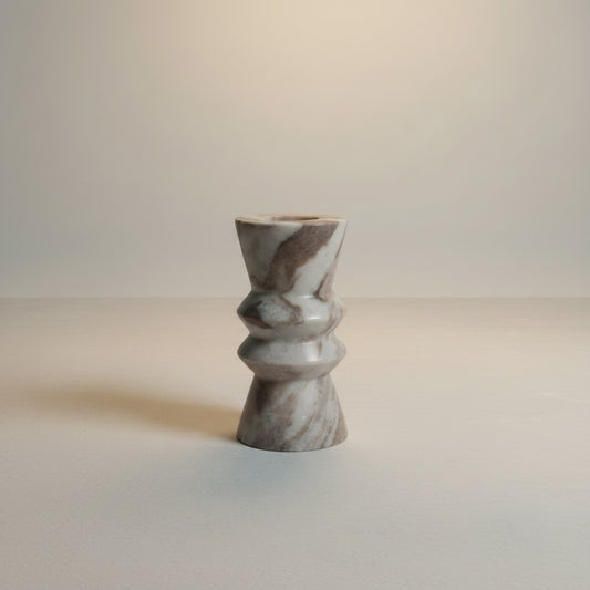 Toronto marble twisted form taper candle holder — angled view showing sculptural ribbed silhouette