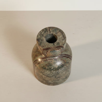 Green Forest marble taper candle holder — side view showing arch silhouette and rich stone colour movement