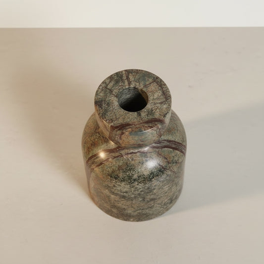Green Forest marble taper candle holder — side view showing arch silhouette and rich stone colour movement