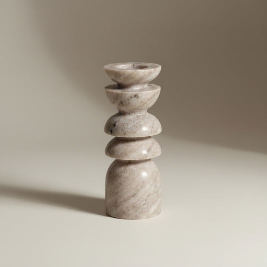 Morchana marble stacked totem candle holder — front view, tower of polished disc segments in warm beige stone