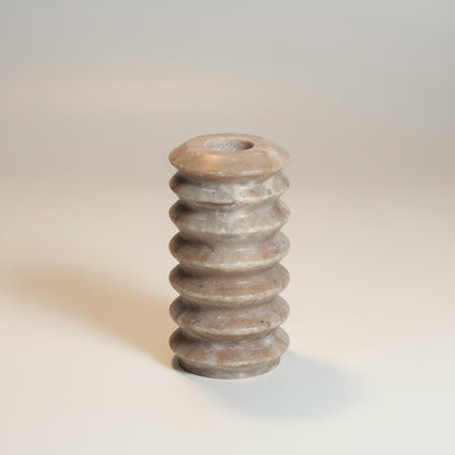 Morchana marble ribbed column candle holder — front view, stacked ring profile in grey-brown honed marble