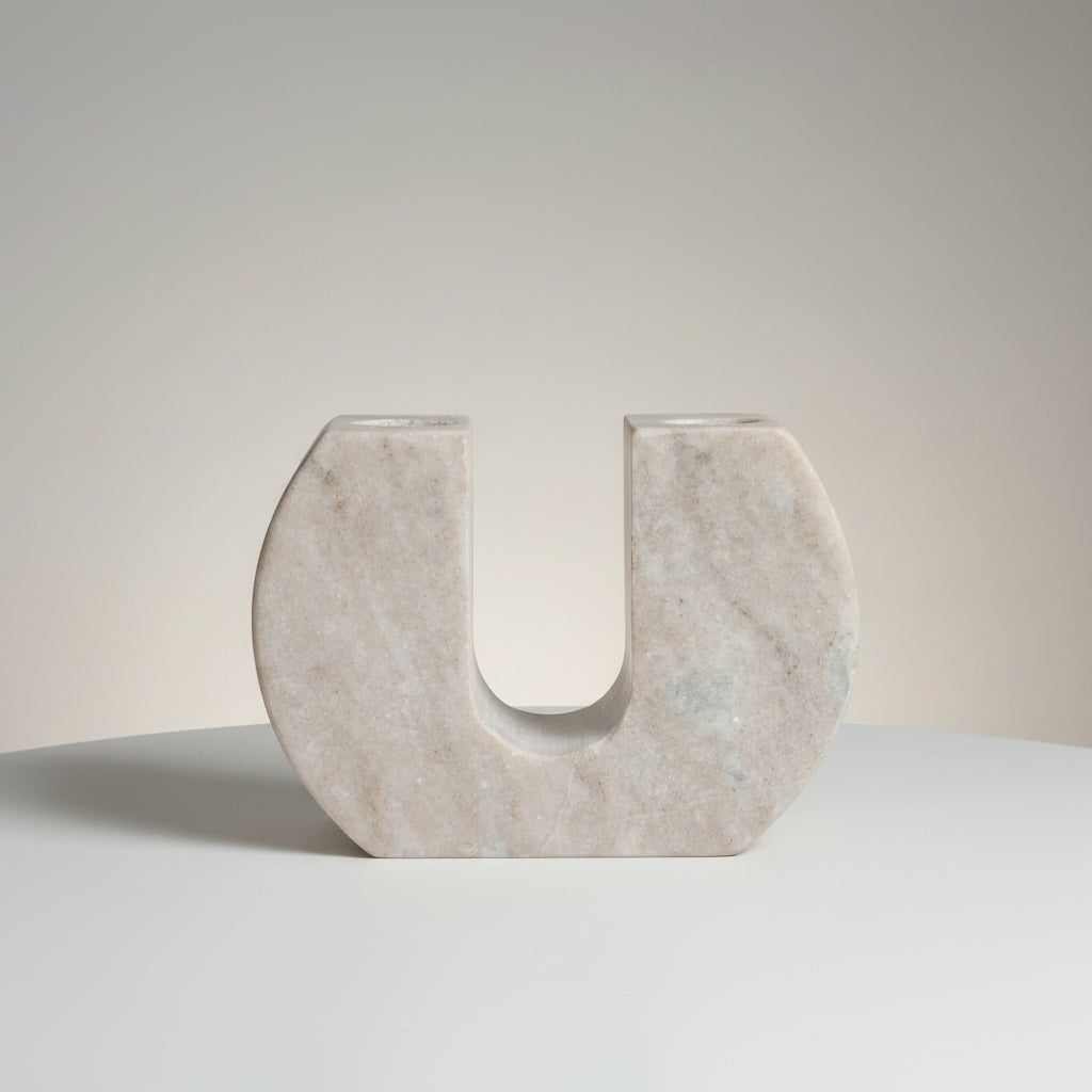 Morchana marble dual arch taper holder — side angle showing sculptural width and minimal marble form