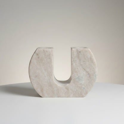 Morchana marble dual arch taper holder — side angle showing sculptural width and minimal marble form