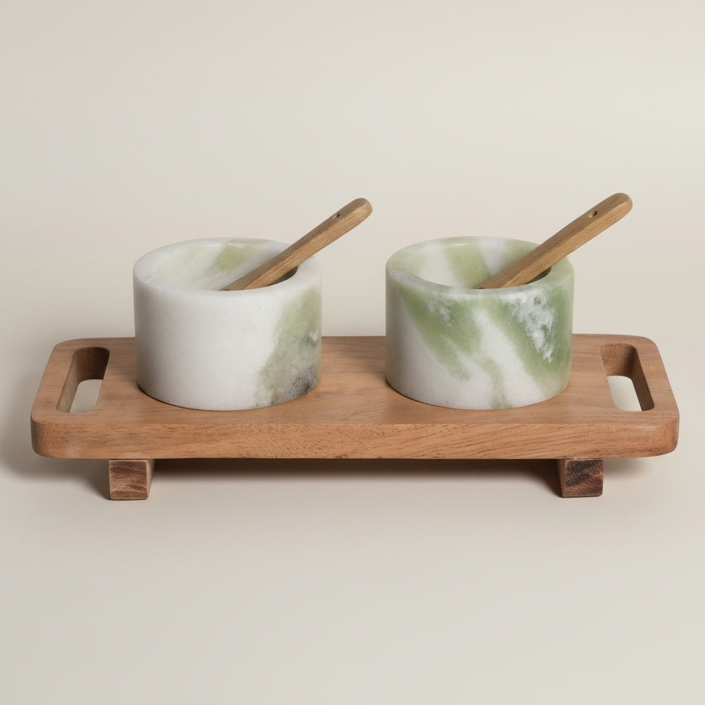 Himalayan green marble pinch pot set — front view showing cylindrical cups with green cloud veining on rectangular footed acacia tray with handle cutouts