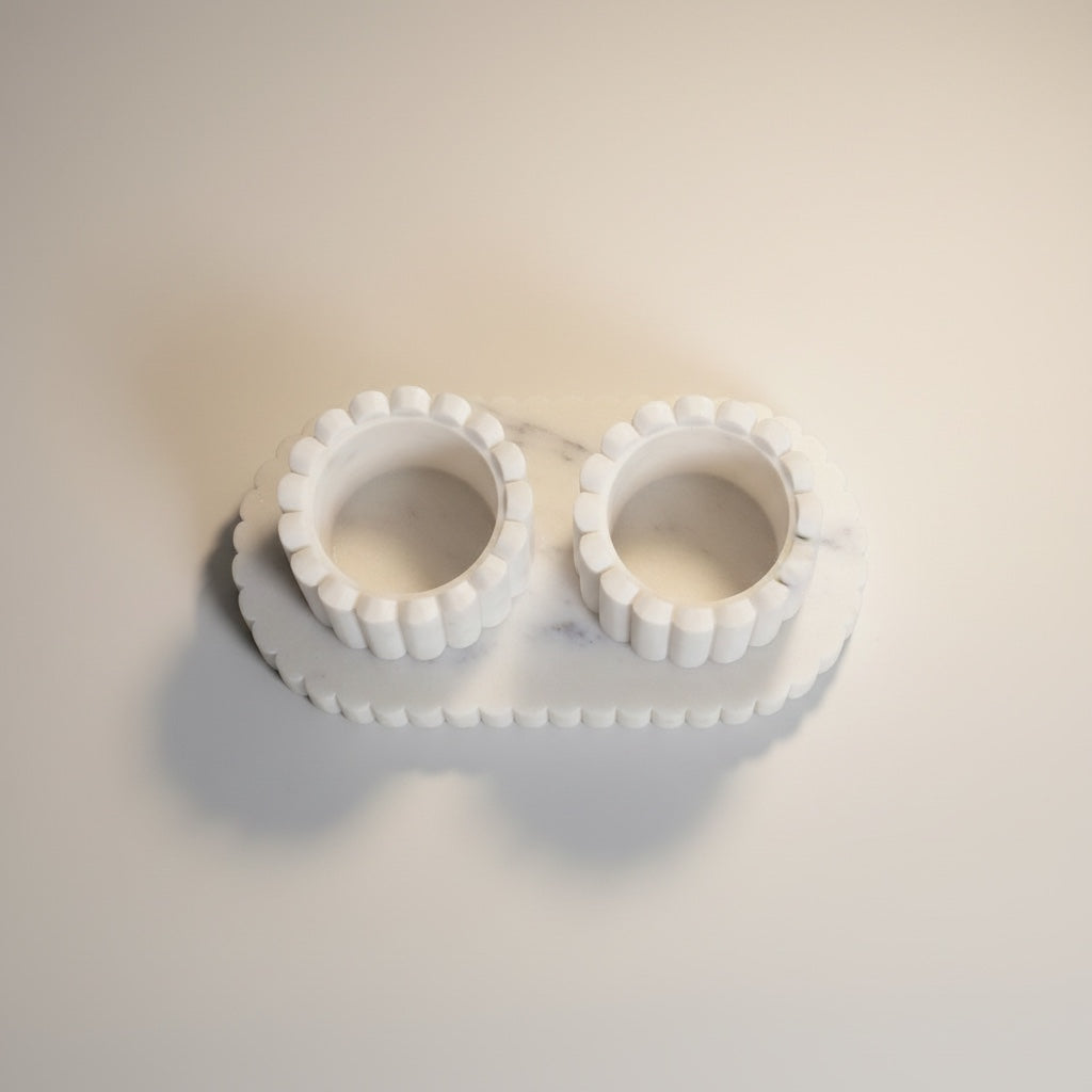 White marble fluted pinch pot set — top-down view showing scalloped cup rims and fluted tray surround from above