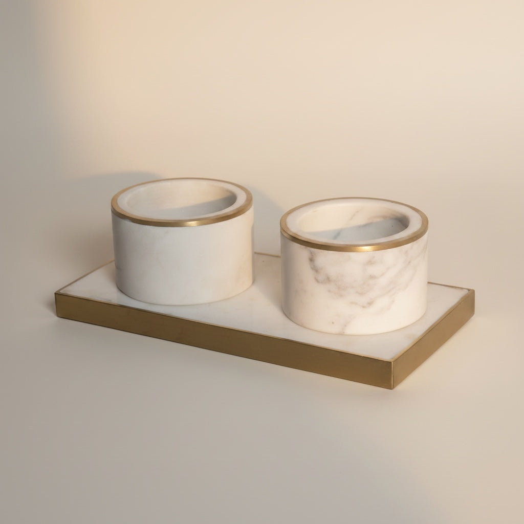 Indian white marble and brass pinch pot set — front view showing natural veining on cups and brushed brass rim detail